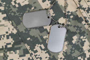 Close up of military uniform and identification tags with chain