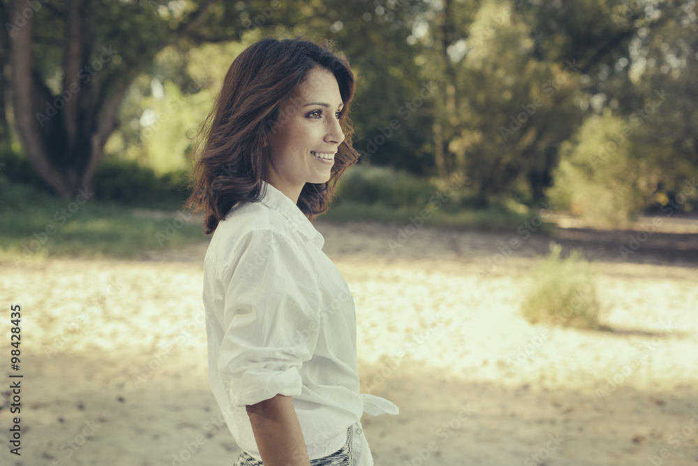 Portrait of smiling woman looking at distance Portrait of smiling woman looking at distance