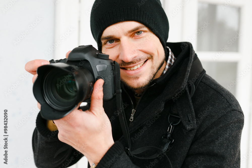 Photographer on walk with a professional camera Photographer on walk with a professional camera