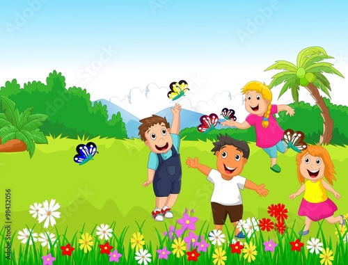 happy children playing with butterflies in the forest