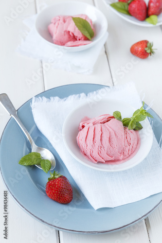 Strawberry ice cream prepared without eggs, studio shot photo