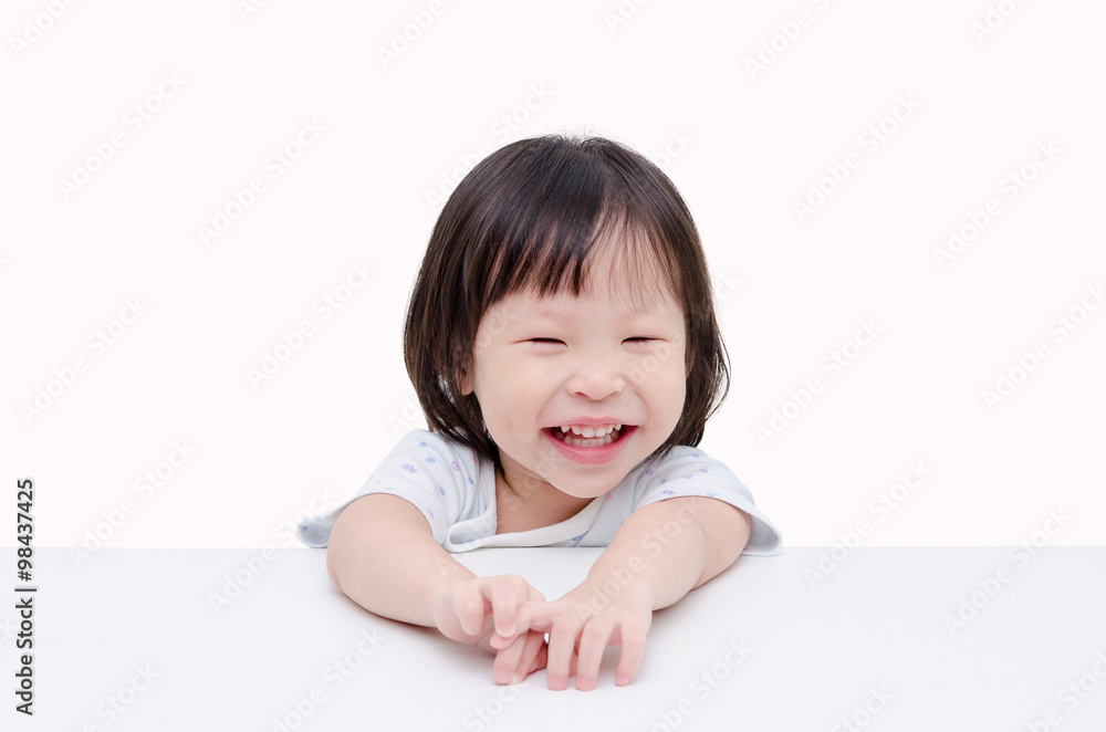 Little Asian girl smiles over white background Little Asian girl smiles over white background