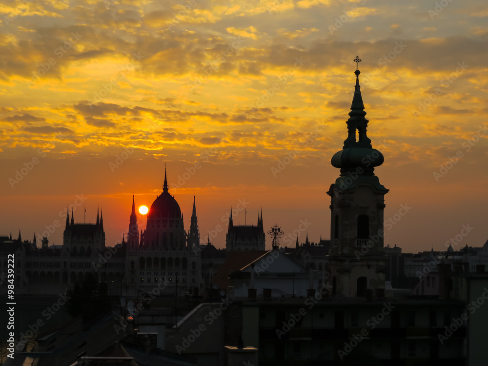 Siluettes of Parliament Building and roofs of Budapest at sunset, Hungary