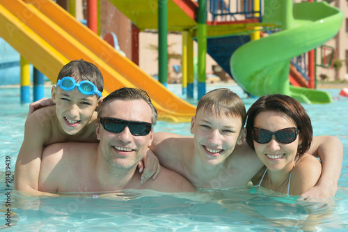 Happy family having in pool