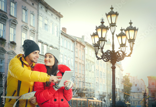 Happy tourists in morning city background