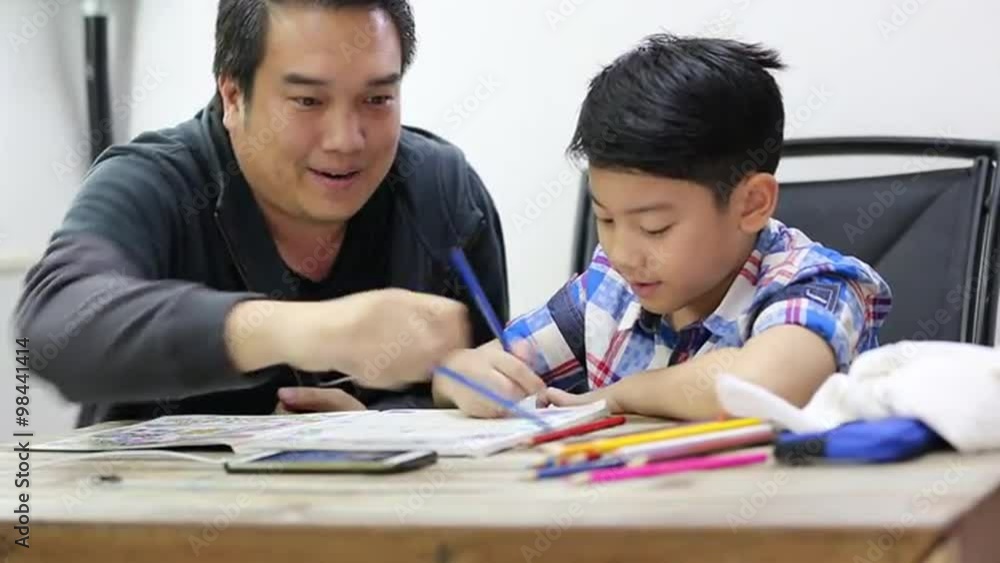 Happy asian family boy and parent drawing together Happy asian family boy and parent drawing together