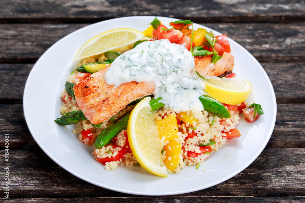Pan fried Salmon with tender asparagus, courgette served on couscous mixed with sweet tomato, yellow pepper, with greek yogurt
