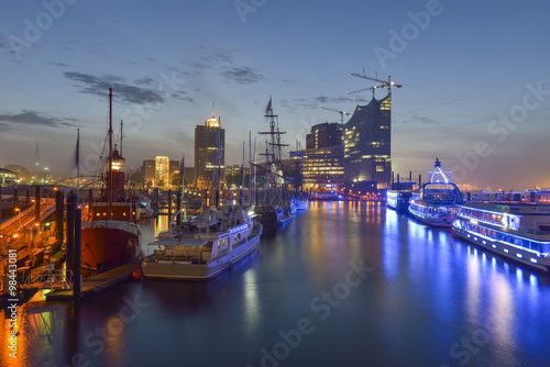 Germany, Hamburg, Niederhafen, in the background the Kehrwiederspitze at night photo