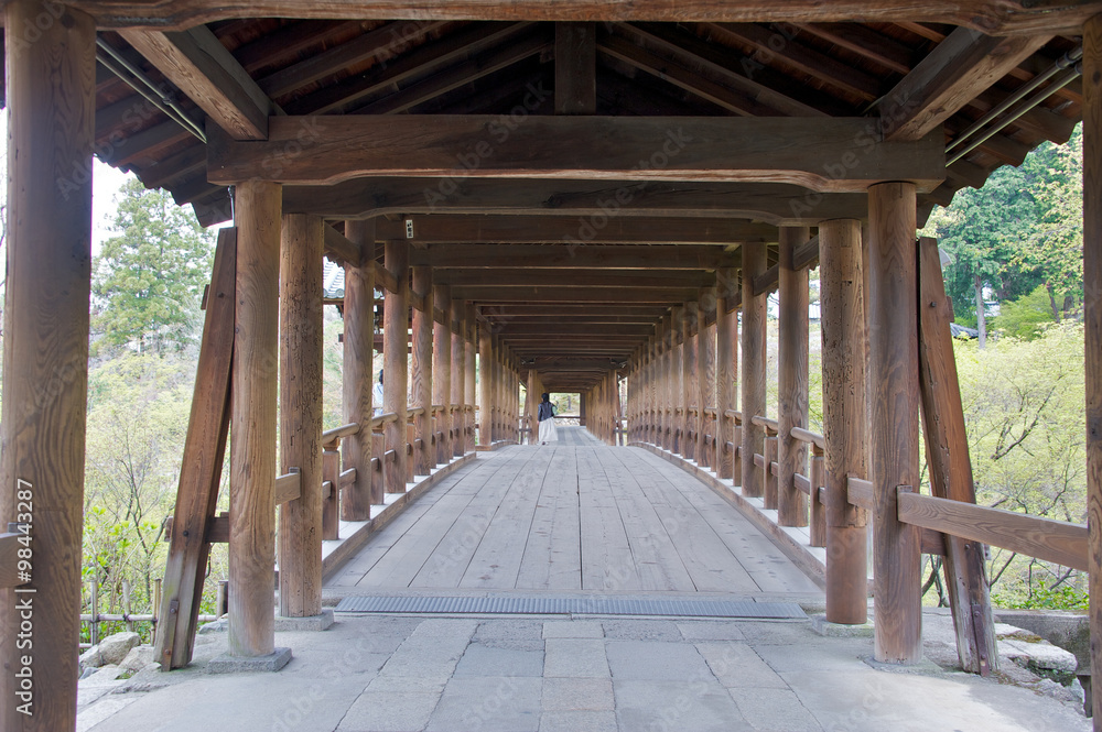 Fototapeta premium Ancient wooden bridge in a temple in Kyoto, Japan