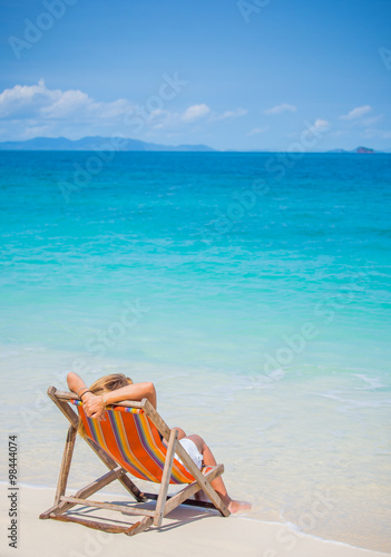 woman relaxing on deck chair