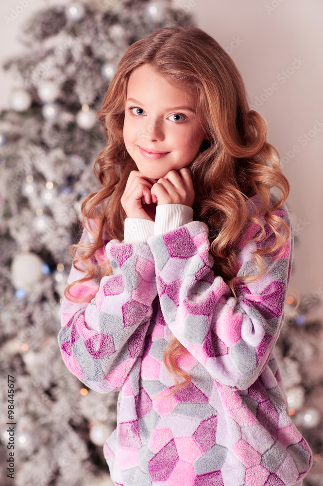 Smiling teenager girl 12 15 year old wearing trendy sweater over
