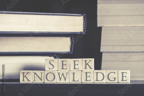 Knowledge concept with quote written on wooden blocks