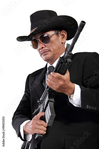 Gentleman with a gun, isolated on white