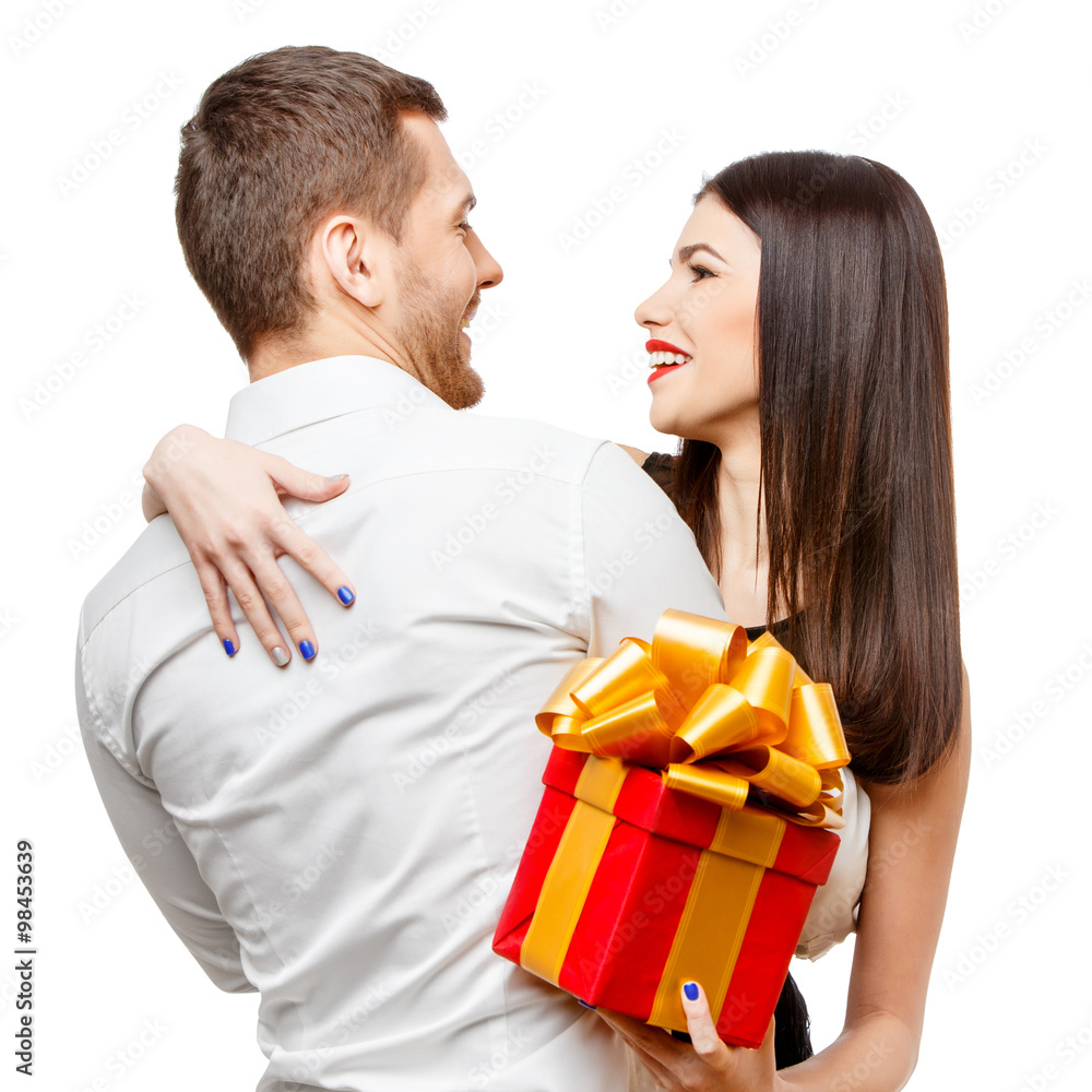 Young beautiful couple with present isolated on white Young beautiful couple with present isolated on white