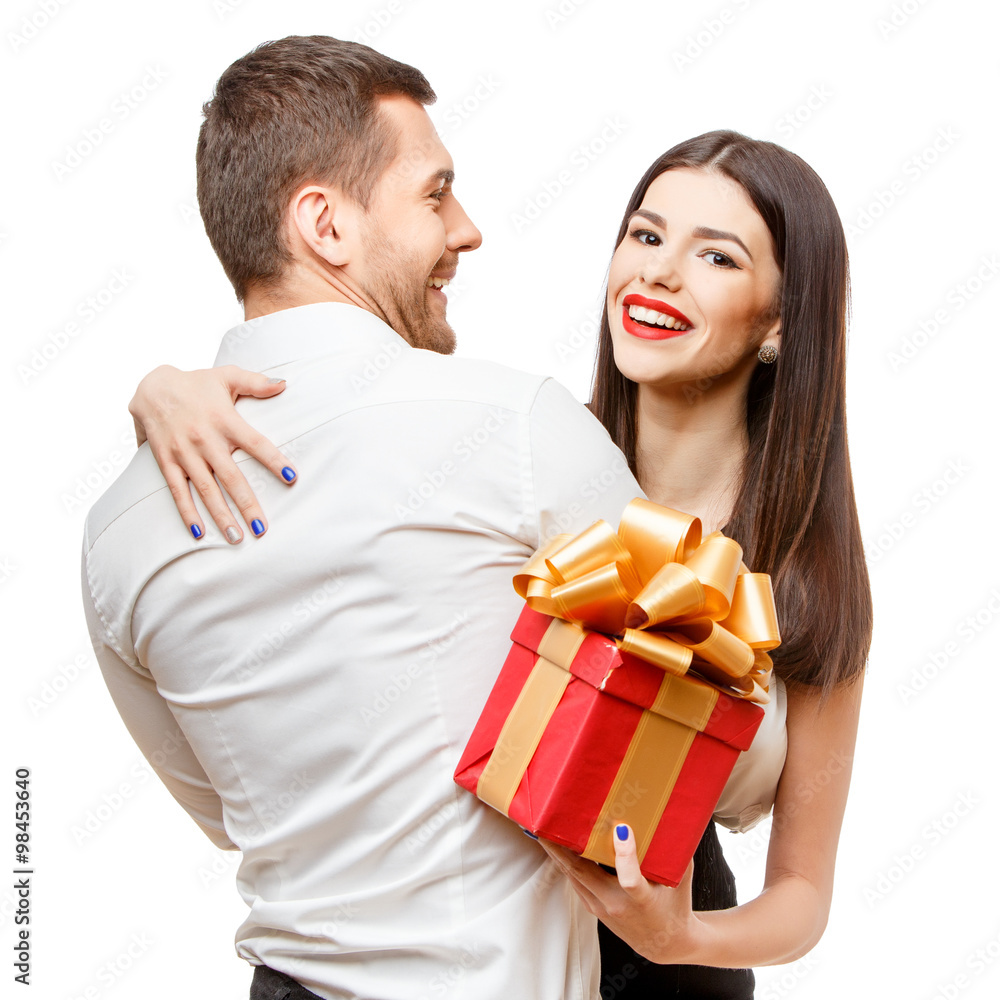 Young beautiful couple with present isolated on white Young beautiful couple with present isolated on white