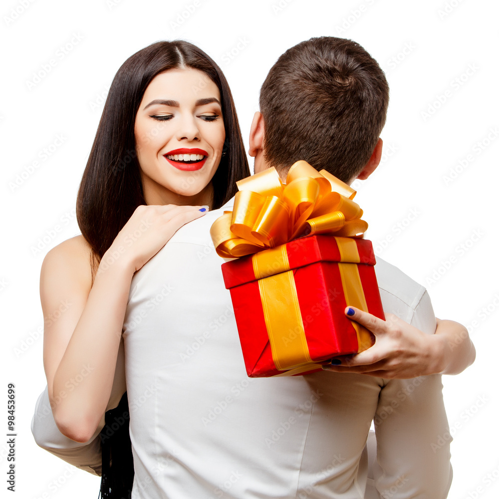 Young beautiful couple with present isolated on white Young beautiful couple with present isolated on white