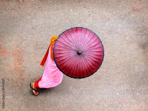 Burmese Monks: Nuns with Pink Umbrellas in Yangon, Myanmar, Walking for Donations photo