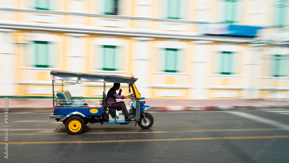 Tuk-Tuk in motion blur. (Tuk-Tuk is the name of Thailand style taxi. You can see many Tuk-Tuk at Bangkok, Thailand)