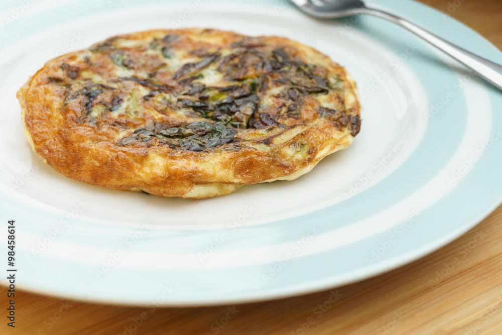 Frittata with onions and cheese. (3/4 view) Frittata with onions and cheese. (3/4 view)
