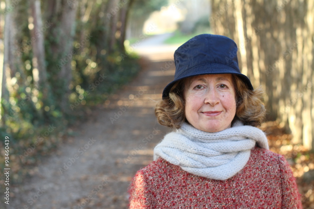 Portrait of a nice old woman in the winter with copy space on the left side Portrait of a nice old woman in the winter with copy space on the left side