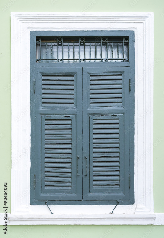 old blue window made out of wood on white wall old blue window made out of wood on white wall