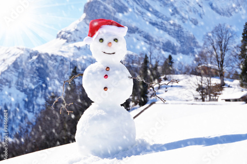 Snowman against Alpine panorama © HappyAlex