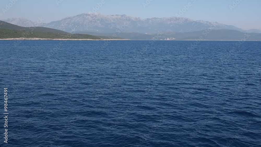 magnificent view to the mountains of Montenegro from moving ship magnificent view to the mountains of Montenegro from moving ship