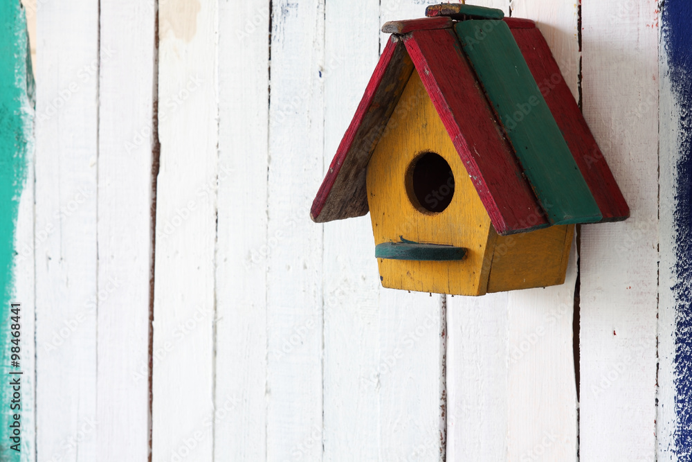 colorful bird house on grunge wall colorful bird house on grunge wall