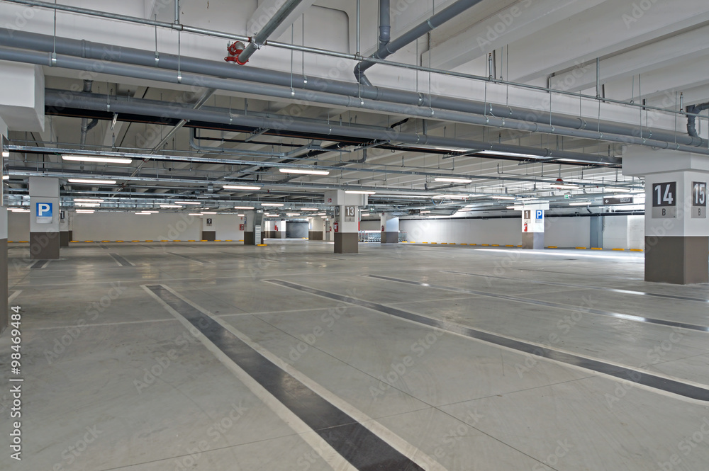Garage, underground interior with empty parking lot of a supermarket Garage, underground interior with empty parking lot of a supermarket