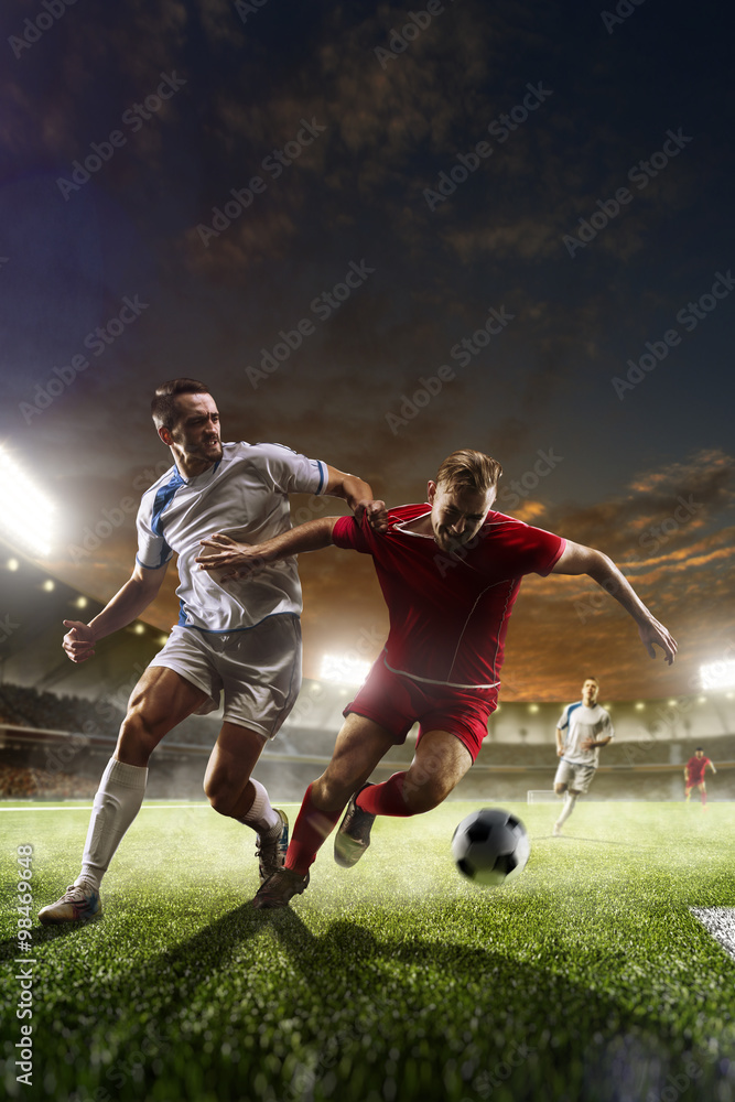 Obraz na płótnie Soccer players in action on sunset stadium background  w salonie