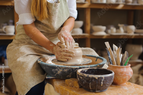 Obraz na plátně hands of a potter, creating an earthen jar on the circle