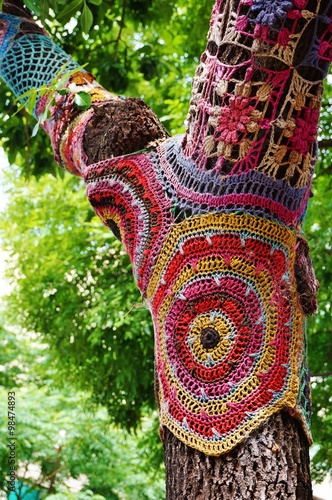 Photography Colorful crochet knit tree trunk (yarn bombing)