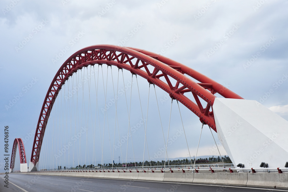 Modern bridge with characteristic red arches