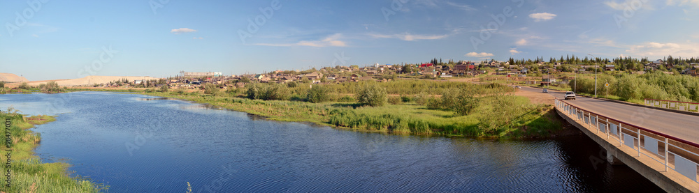 Rural area in the town of Mirny, Irelyakh bridge over the river.