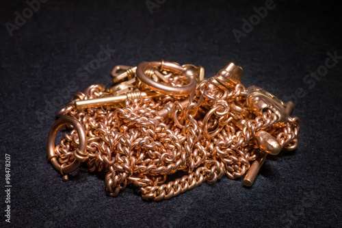 Golden chains on black felt...
