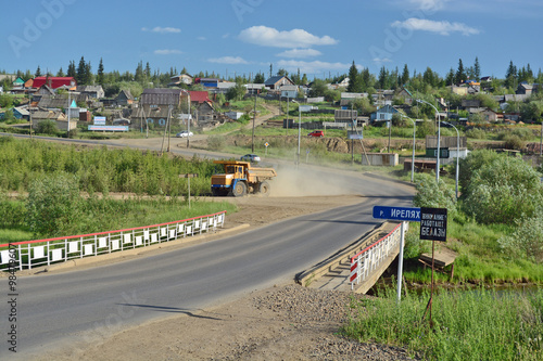 Rural area in the town of Mirny, Irelyakh bridge over the river.