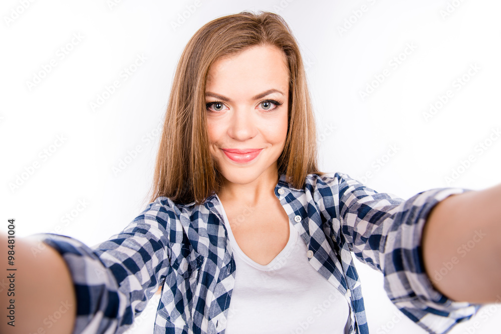 Nice-looking cute young woman making selfie photo Nice-looking cute young woman making selfie photo