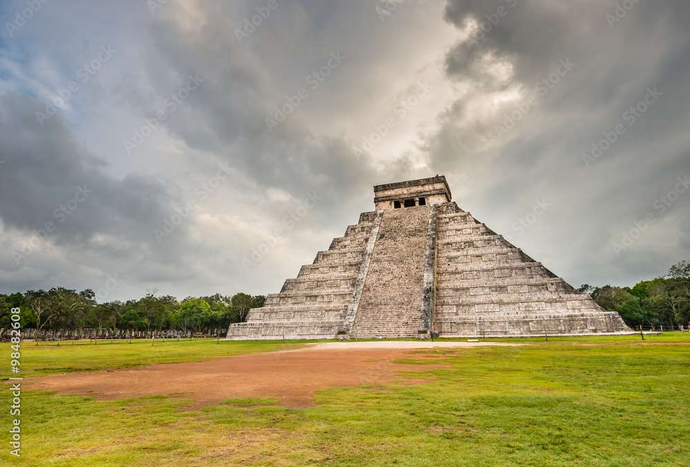 Mayan Chichen Itza pyramid with dramatic cloudy sky in Mexico Mayan Chichen Itza pyramid with dramatic cloudy sky in Mexico