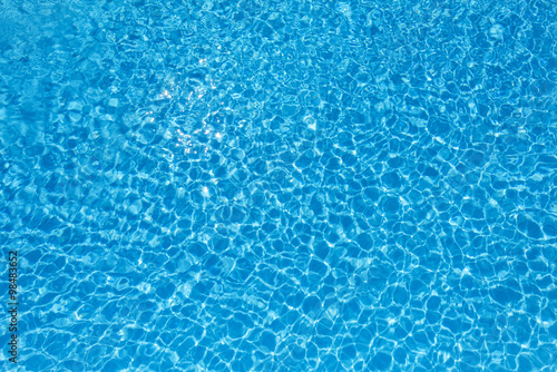 Blue and bright water surface in swimming pool