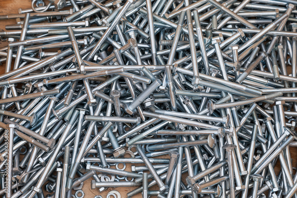 Chrome metal fastening bolts as background Chrome metal fastening bolts as background