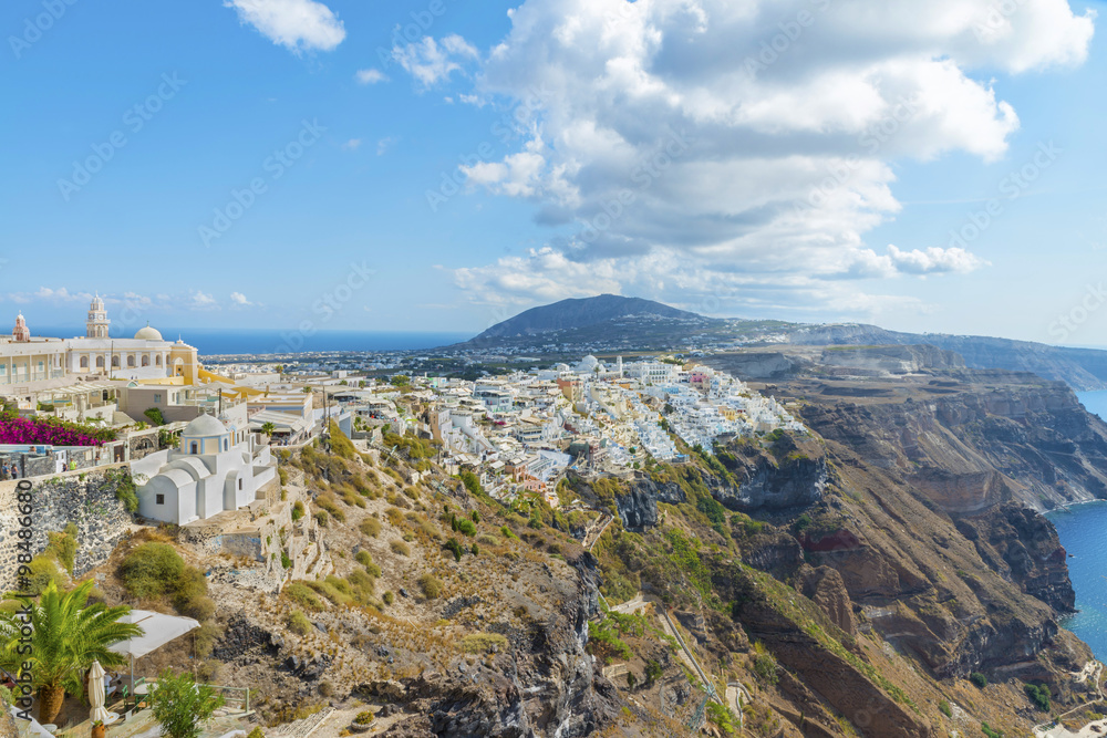 The picturesque panoramic view from the height on the town of Fira and the surrounding area .Fira is the capital of the island Santorini (Thira).Cycladic archipelago.Greece.Europe.