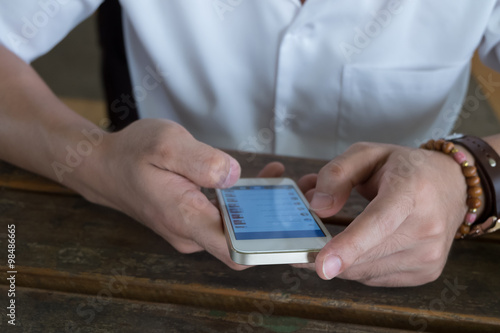 businessman using a mobile phone with texting message