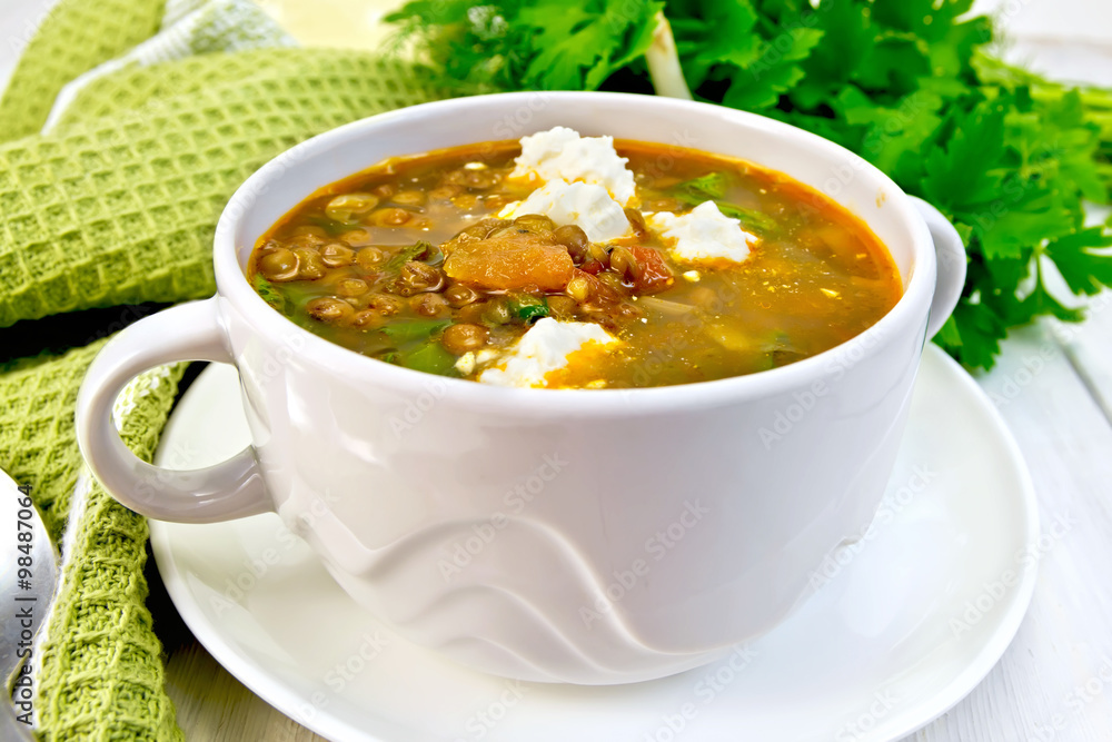Soup lentil with spinach and feta on board Soup lentil with spinach and feta on board