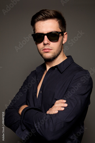 portrait of a young man on a gray background © gna60