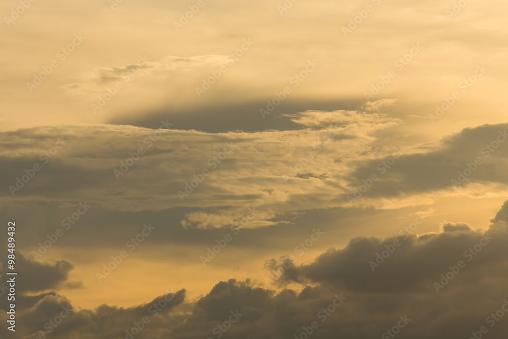 beautiful sunset sky, golden light of sun on dramatic moody sky