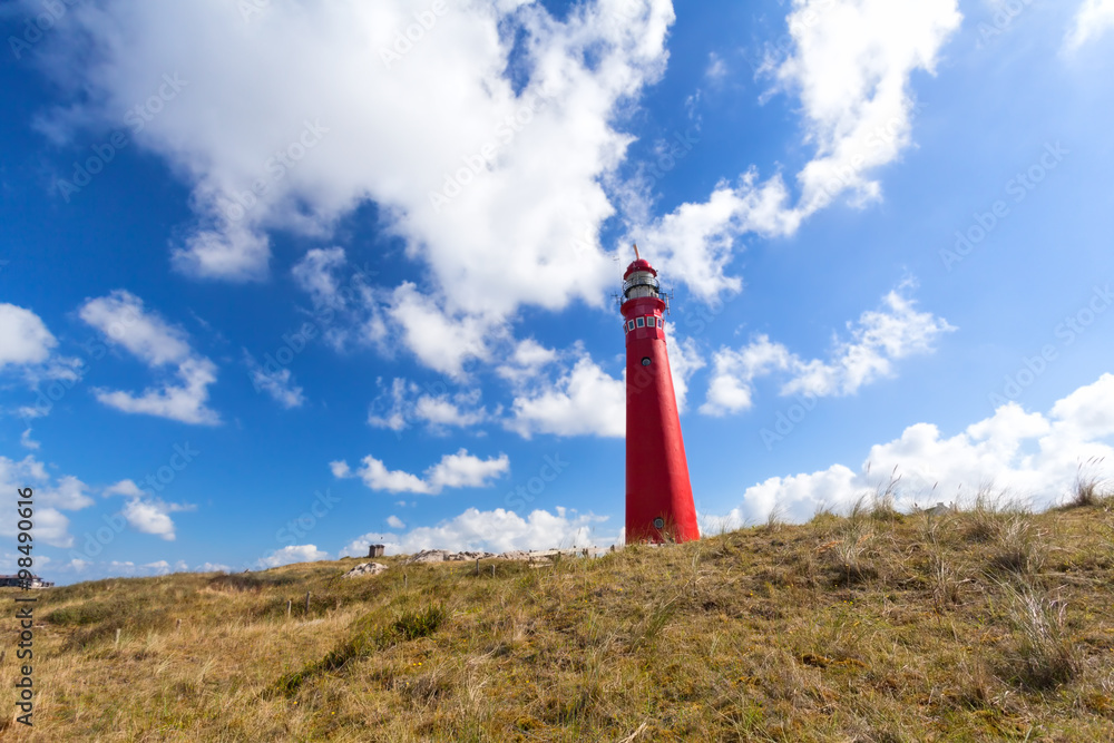 red lighthouse over blue sky