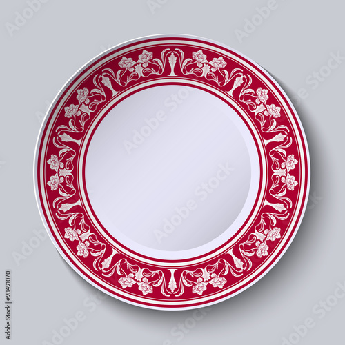 Photography Red ornament with with flowers at the edge of the ceramic plate
