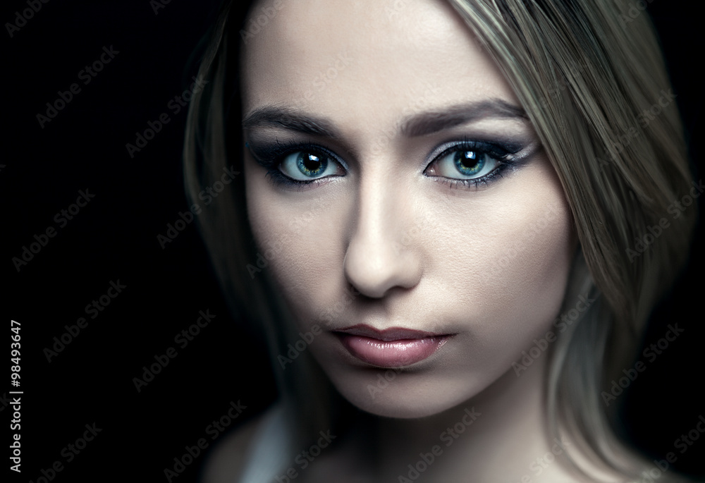 face of a beautiful girl on a black background face of a beautiful girl on a black background