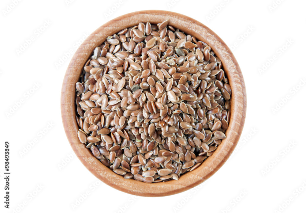 Flax seeds in wooden bowl isolated on white background, top view Flax seeds in wooden bowl isolated on white background, top view