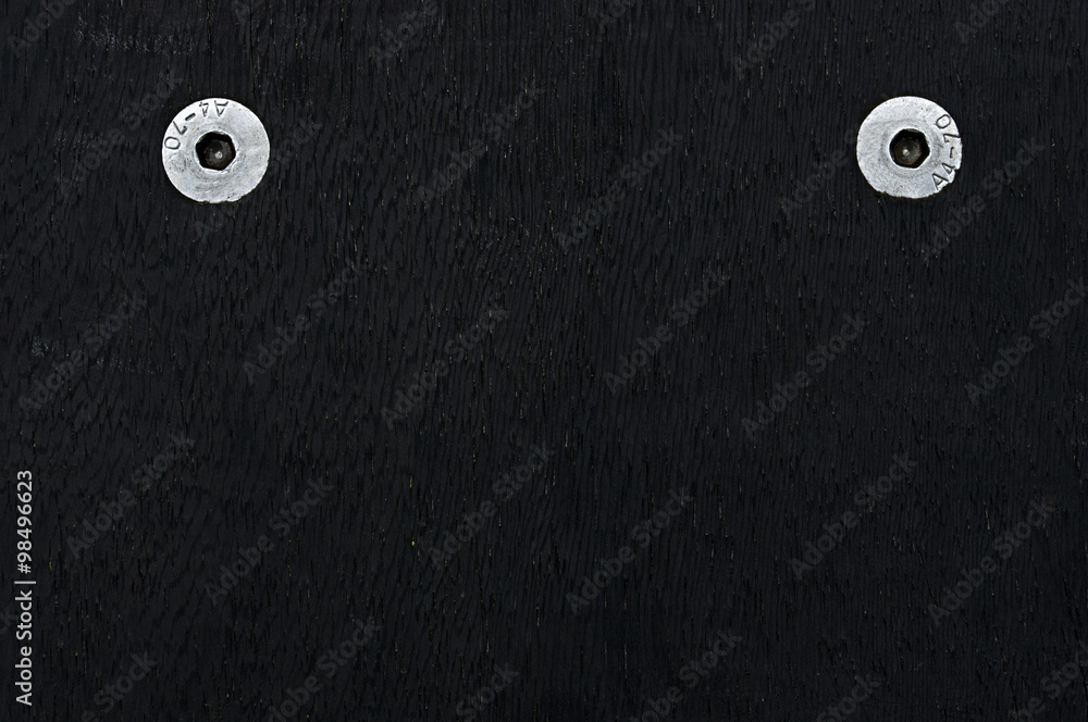 Dark wood texture with white metal screws in coners Dark wood texture with white metal screws in coners